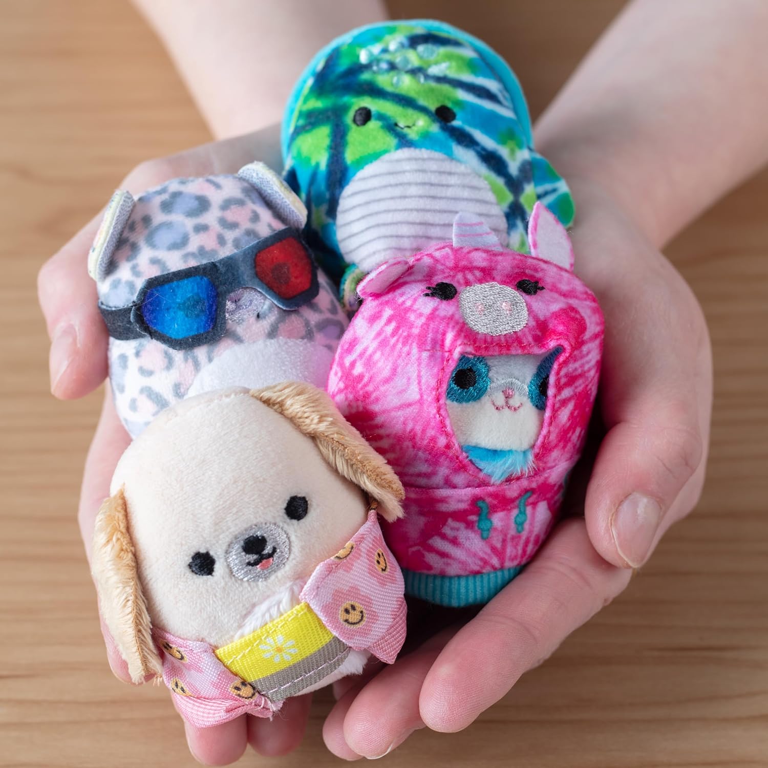 squishmallows in a hand