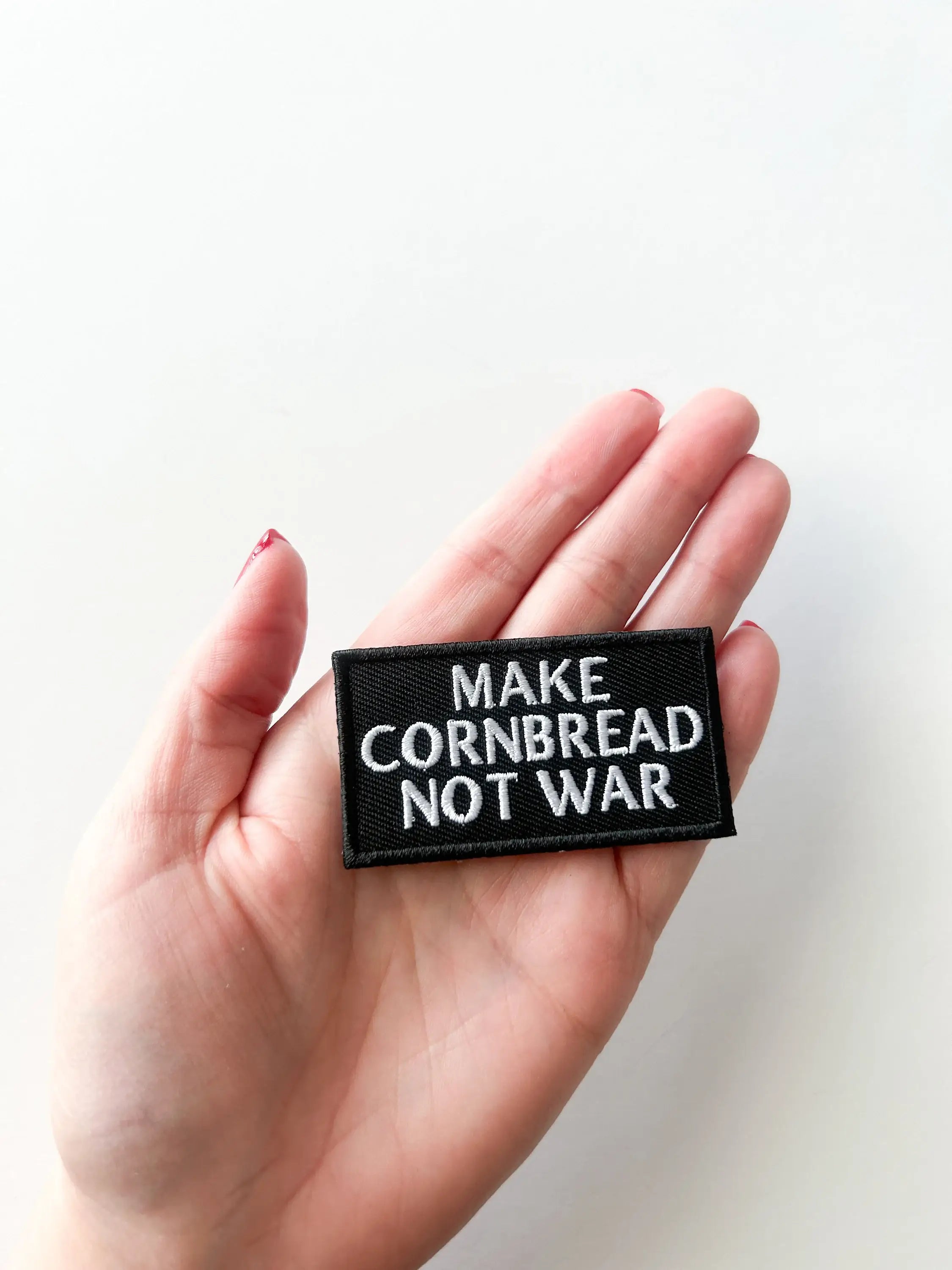 Embroidered "Make Cornbread Not War" Black Iron-on Patch