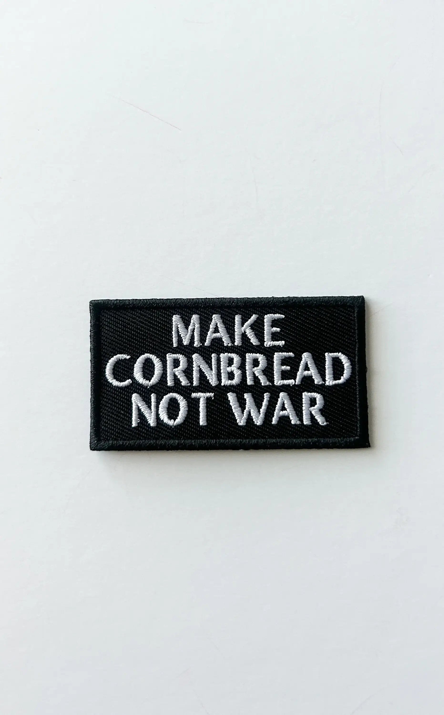 Embroidered "Make Cornbread Not War" Black Iron-on Patch