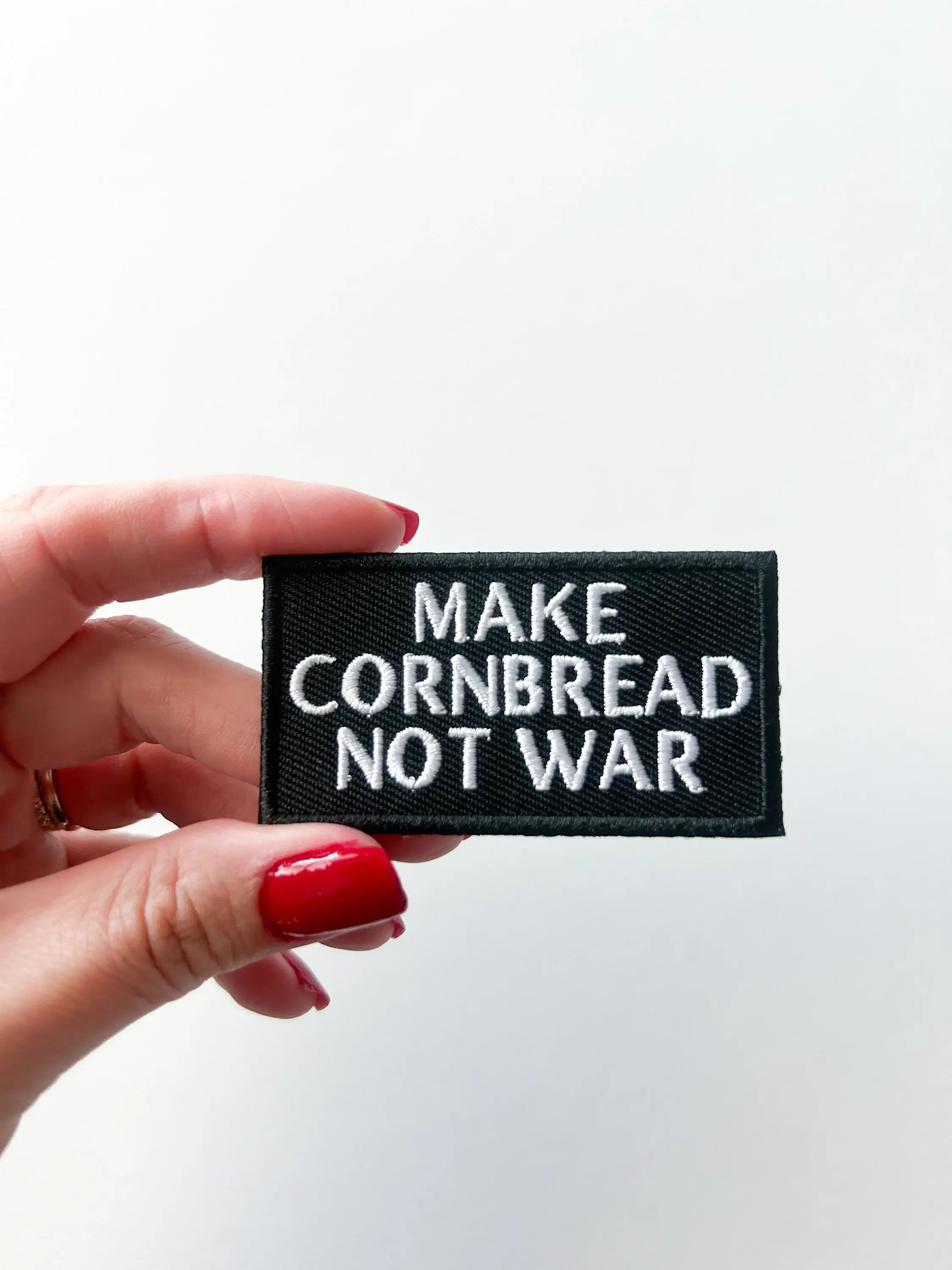 Embroidered "Make Cornbread Not War" Black Iron-on Patch